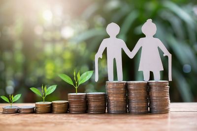 Old couple model standing on money coins, Asset Management, Pensions and Hedge Funds, Financial Services | DXC Technology